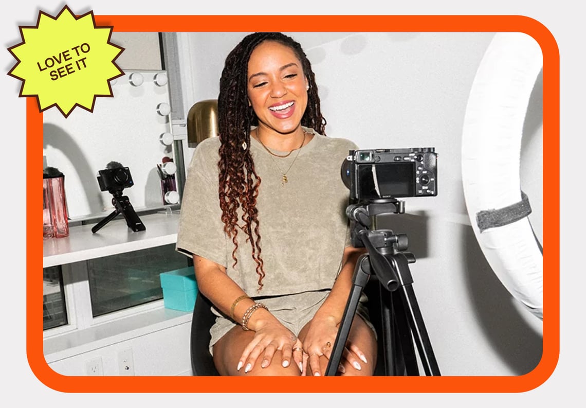 Photo of a smiling vlogger talking to the camera