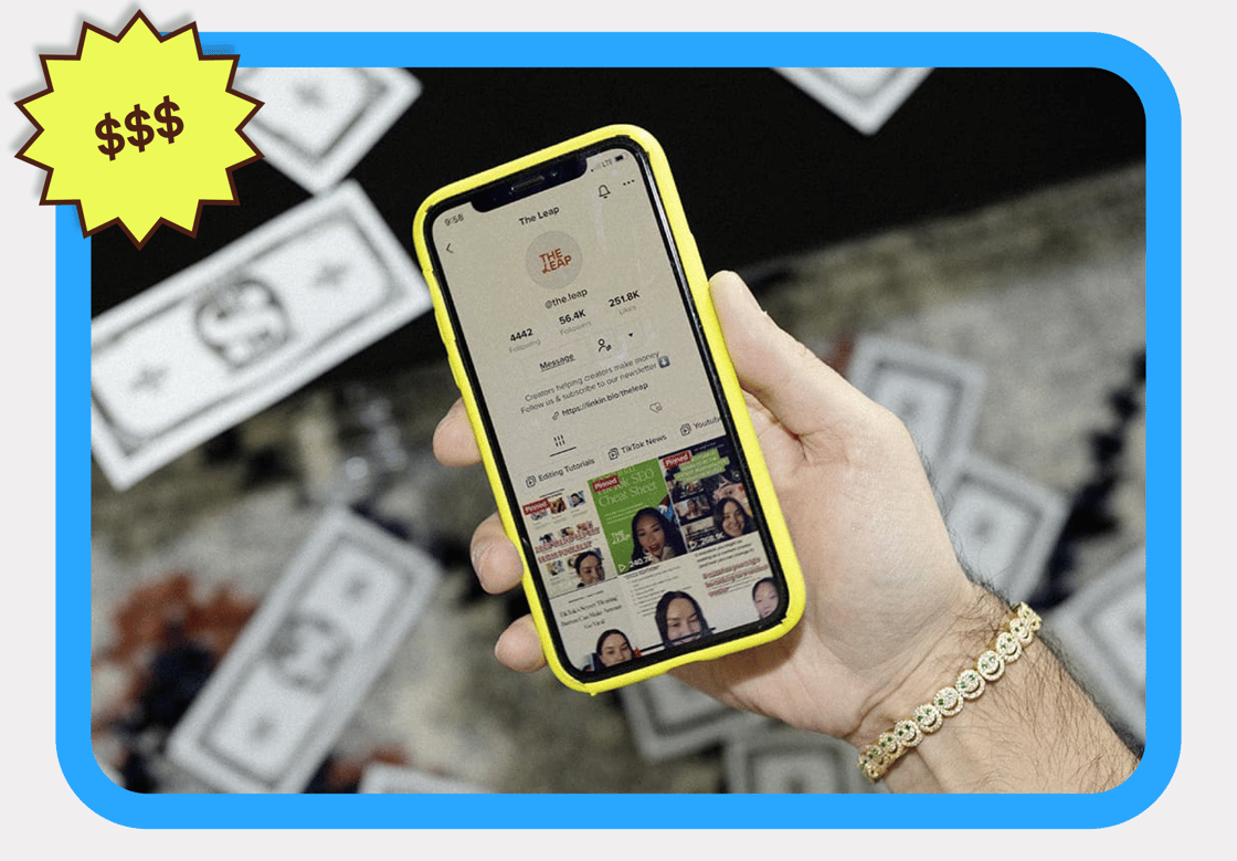 A man holding a phone with Leap's Tiktok account showing on screen