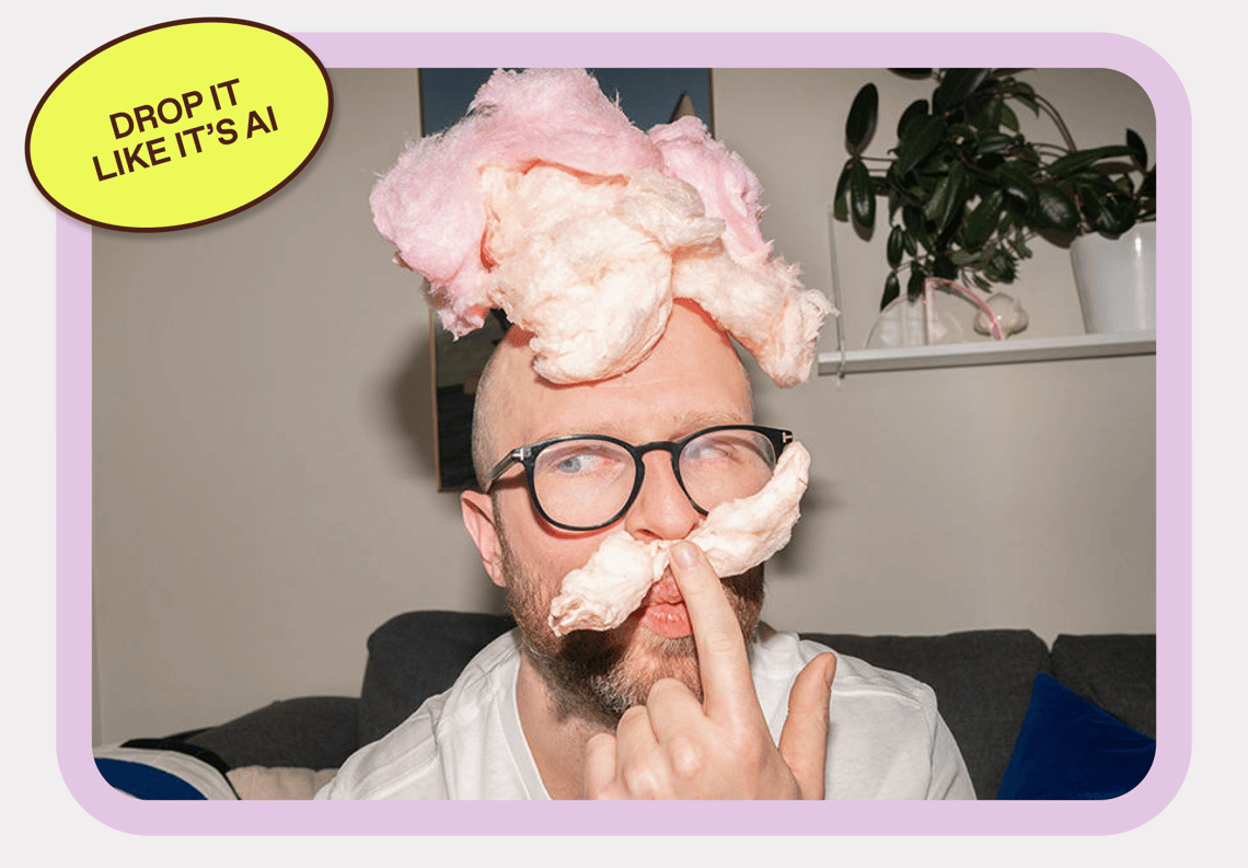 A man with glasses with cotton candy on top of his head and cotton candy moustache
